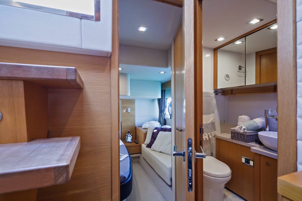 luxury yachts - bathroom and view into bedroom