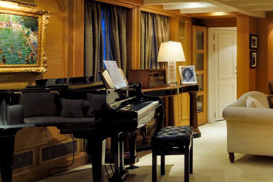 luxury yachts - piano with sheet music and sofa in living room