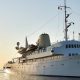 luxury yachts - white yacht at sunset