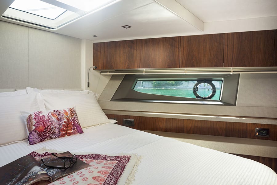 luxury yachts - bedroom of yacht with side and roof windows