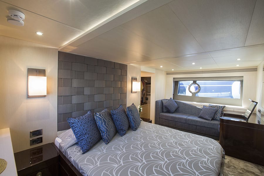 luxury yachts - large bedroom with bed and sofa