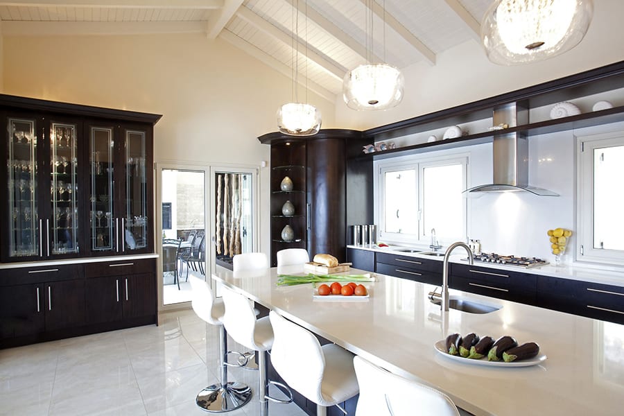 luxury villas - luxurious kitchen with cooking island and bar chairs