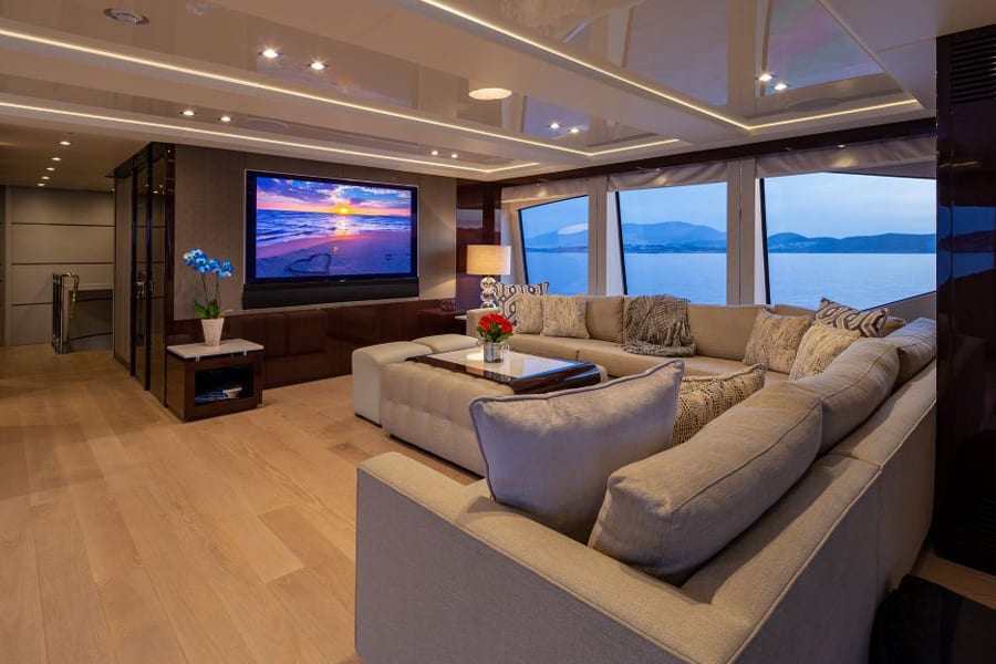 luxury yachts - living room of yacht with sofa and tv