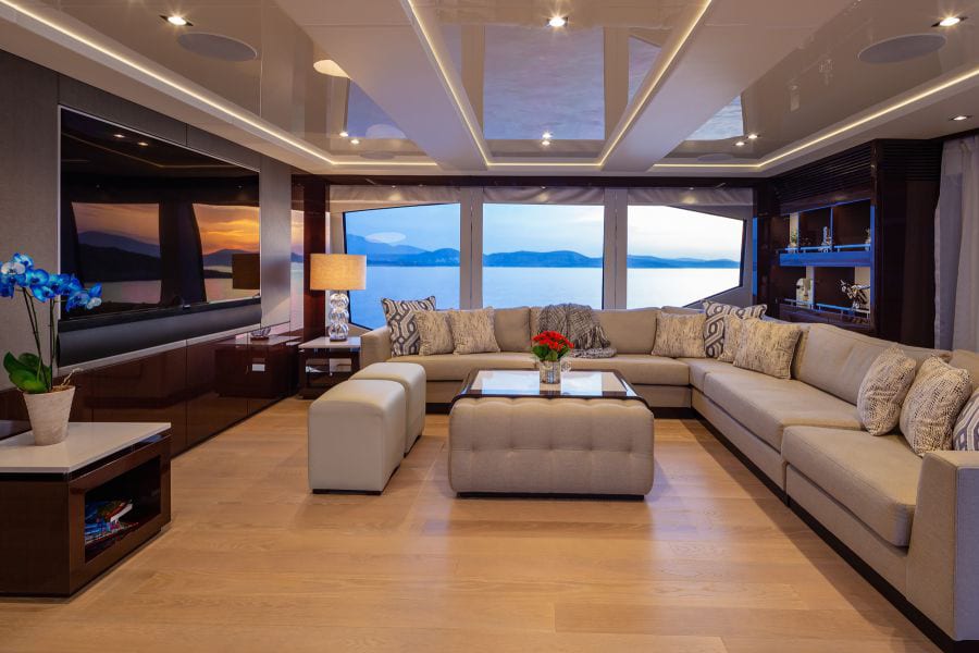 luxury yachts - living room of yacht with sofa, tv and large windows