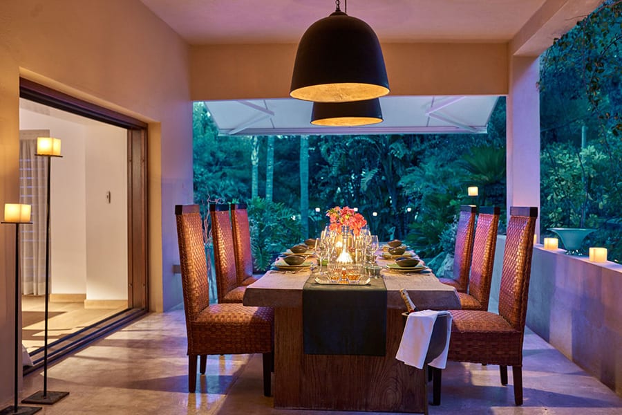 luxury villas - outside dining area with beautiful set up by night