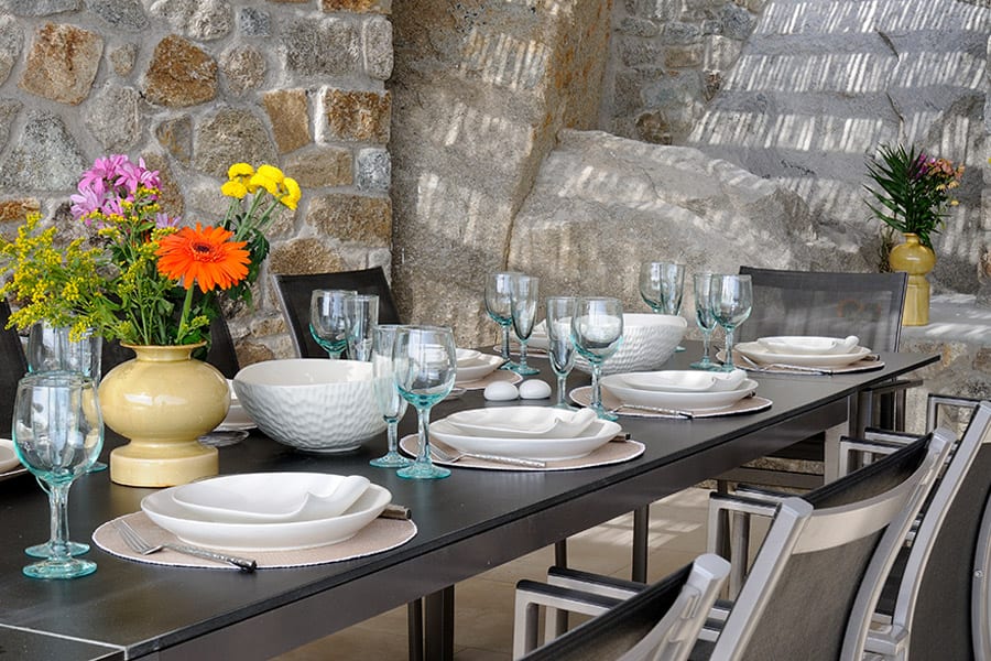 luxury villas - set outdoor table with stone wall in background