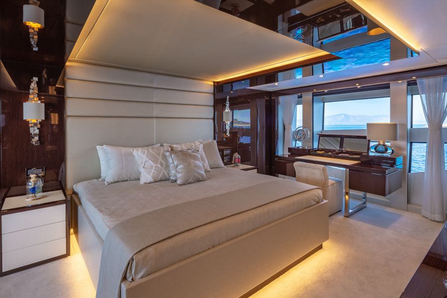 luxury yachts - bedroom of yacht with ambiance lights and sea view
