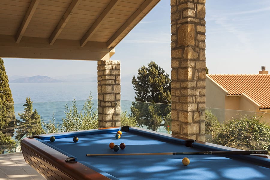 luxury villas - pool table outside with sea view