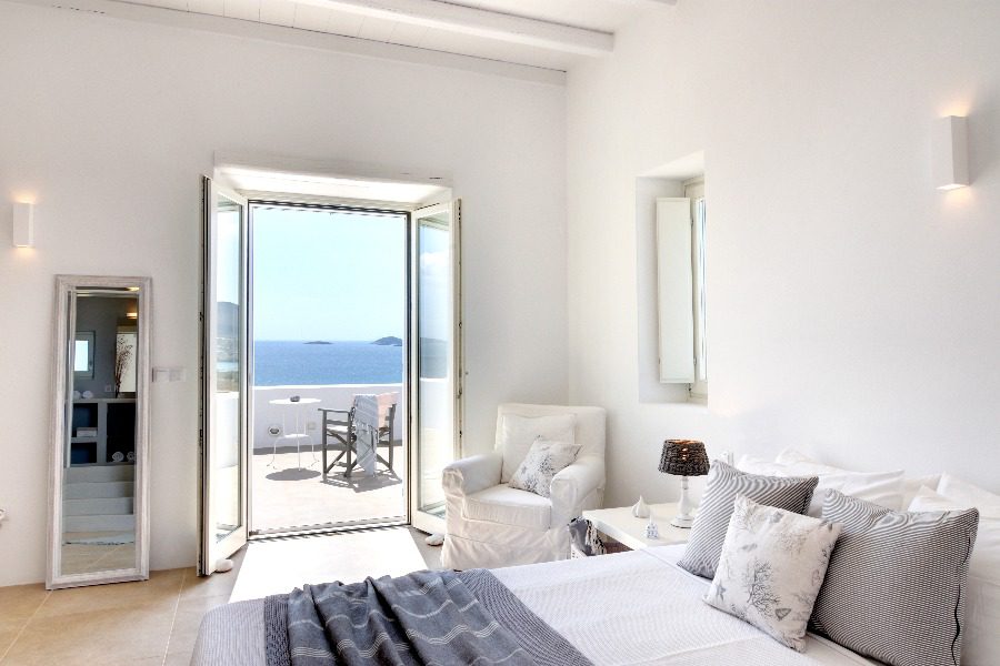 luxury villas - bedroom with double bed with view to terrace and sea view