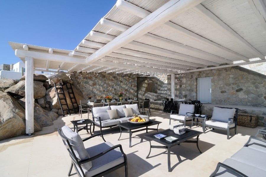 luxury villas - outside relaxing area with armchairs, sofas and table