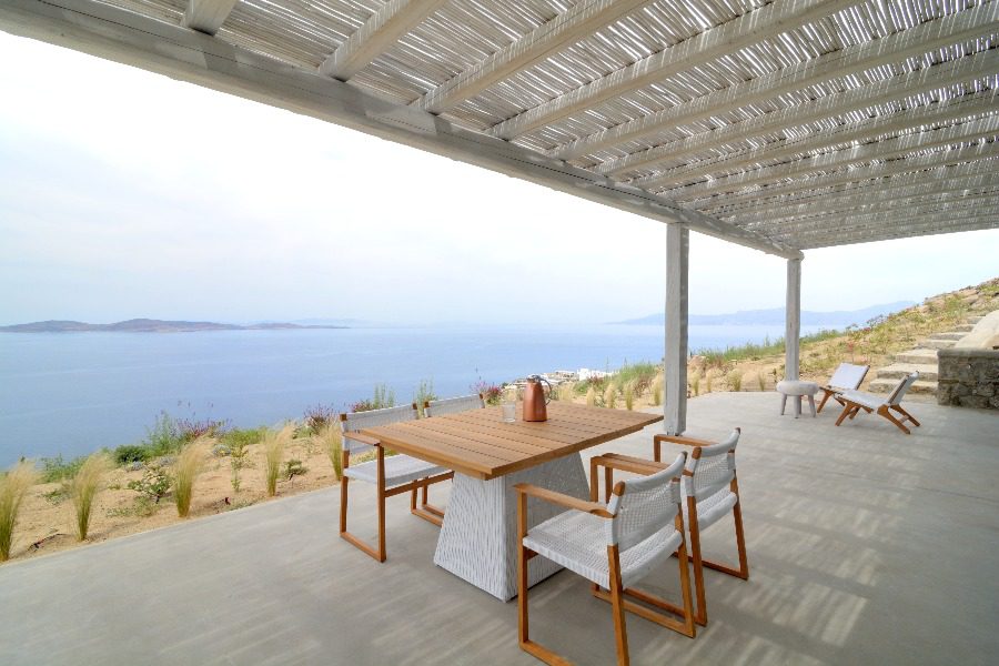 luxury villas - patio with outside dining table and chairs with sea view