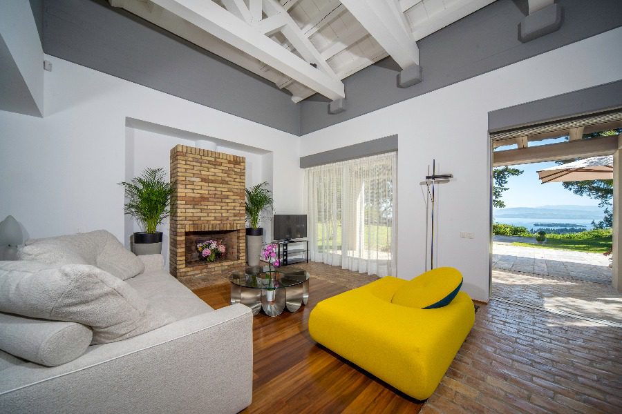 luxury villas - living room with sofa and open door to terrace