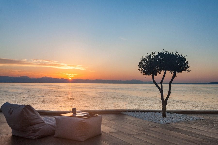 luxury villas - patio with relaxing chair at sunset