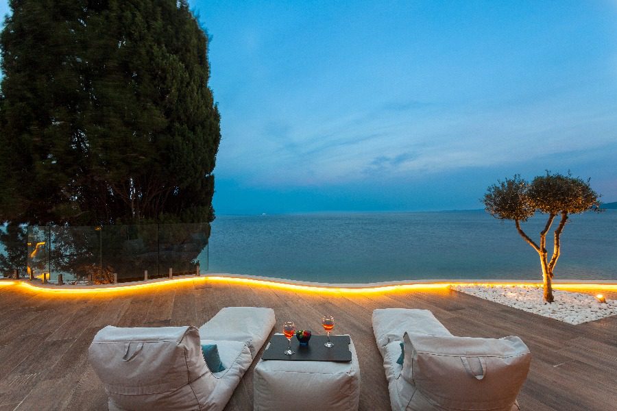 luxury villas - relaxing lounge beds with drinks and seaview at night