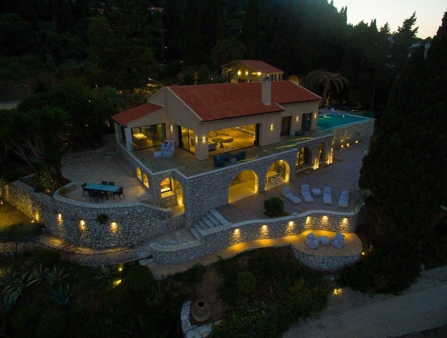 luxury villas - drone shot of villa by night