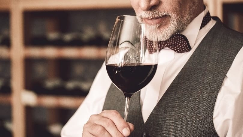 luxury experiences - man drinking wine