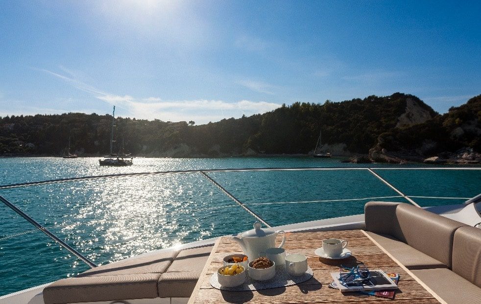 luxury yachts - breakfast on deck of luxurious yacht on the sea