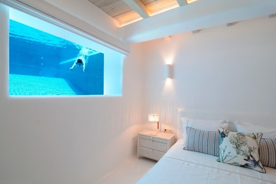 luxury villas - bedroom with window to pool under water