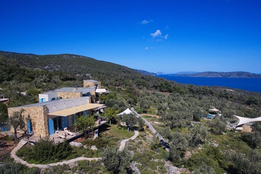 luxury villas - drone shot of villa with sea view