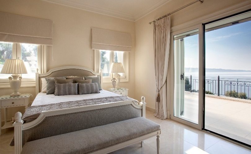 luxury villas - bedroom with double bed and terrace