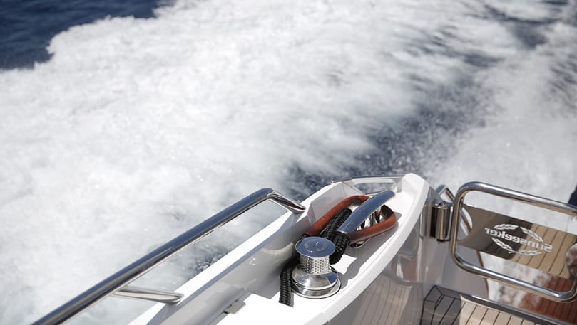 luxury yachts - rail of yacht and sea with waves