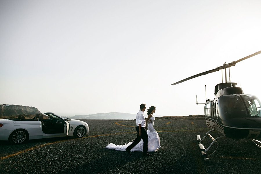 luxury transportation - wedding couple getting into helicopter