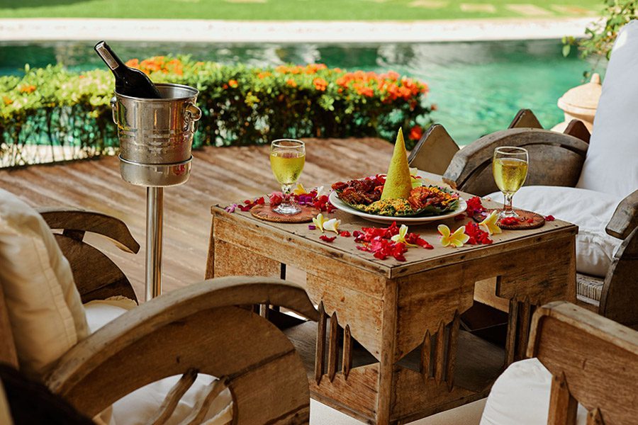 luxury services - table with white wine and fruits