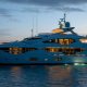 luxury yachts - side view of yacht at sunset on the sea