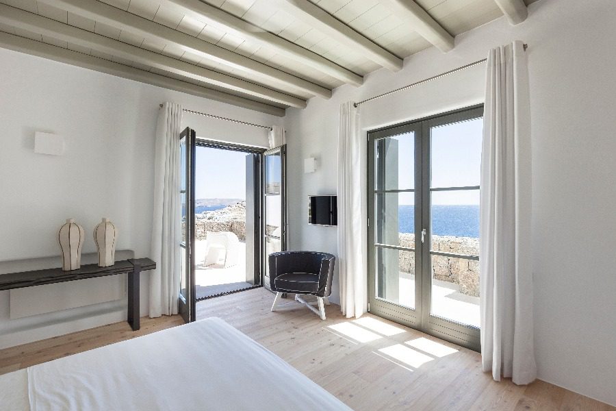 luxury villas - bedroom with double bed and open door to terrace