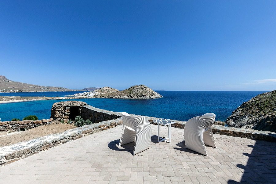 luxury villas - terrace with chairs and table with stunning sea view
