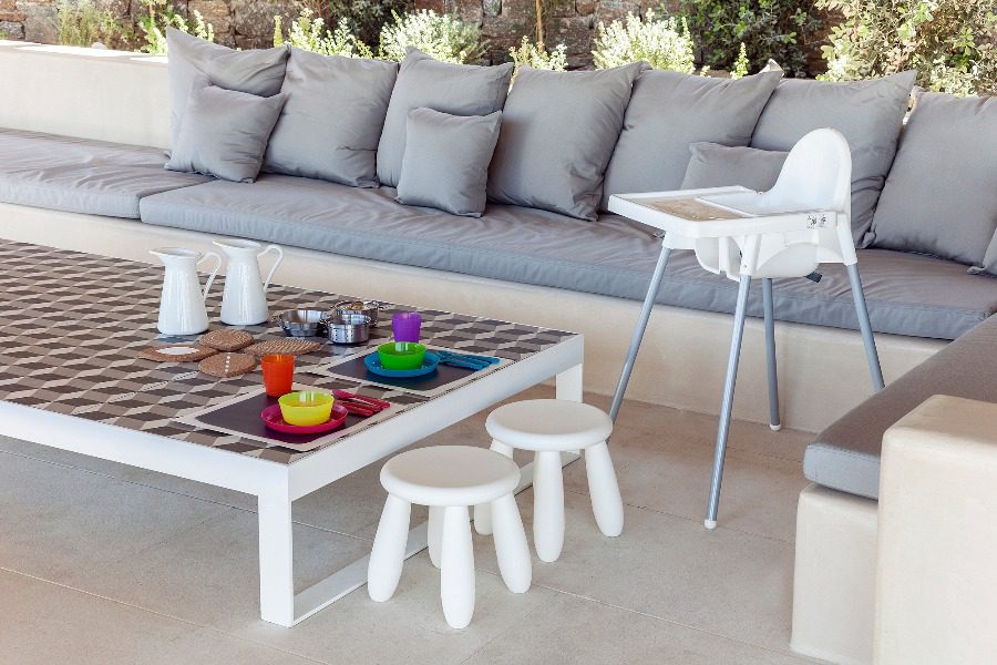 luxury villas - outside relaxing area with children plates