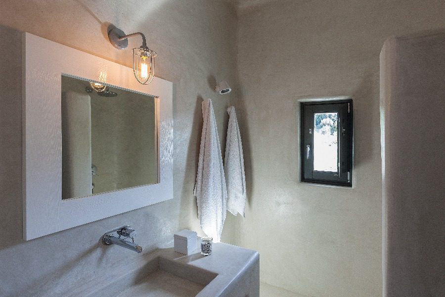 luxury villas - bathroom with sink and towels on the wall