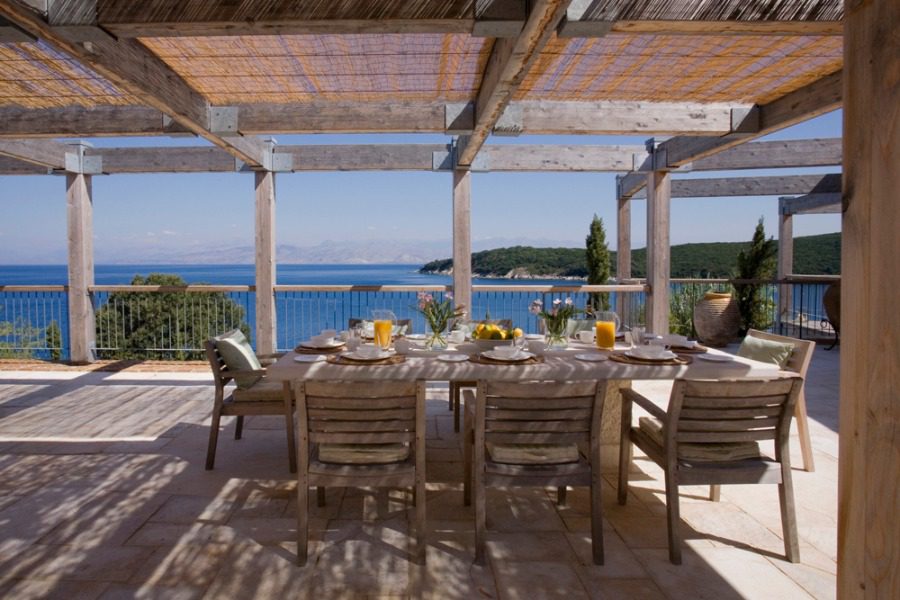 luxury villas - outside dining table set up and beautiful sea view