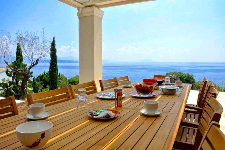 luxury villas - outside dining area with fresh fruits and sea view
