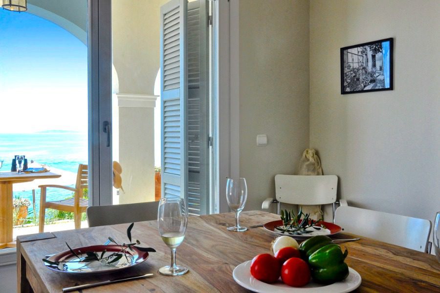 luxury villas - table with wine and sea view