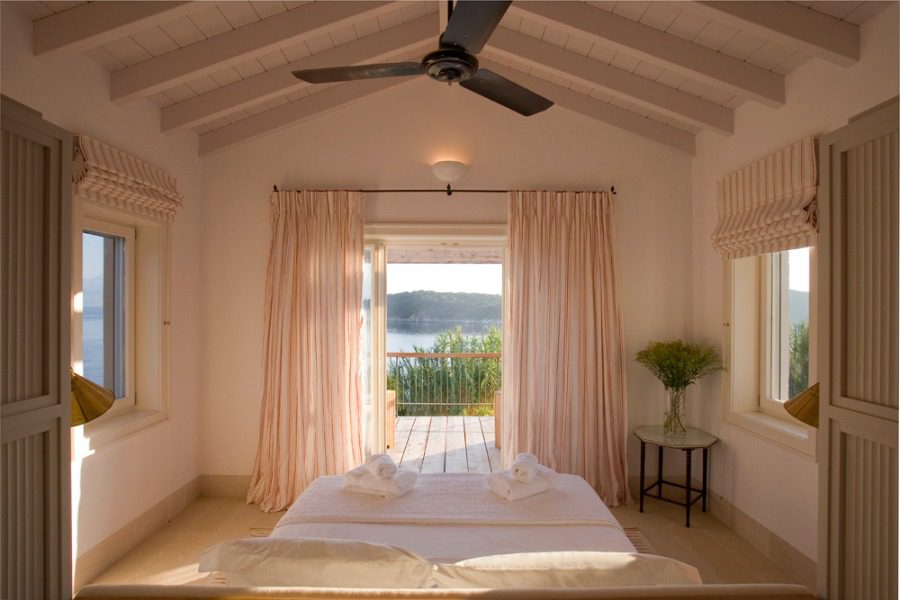 luxury villas - bedroom with double bed and view to terrace