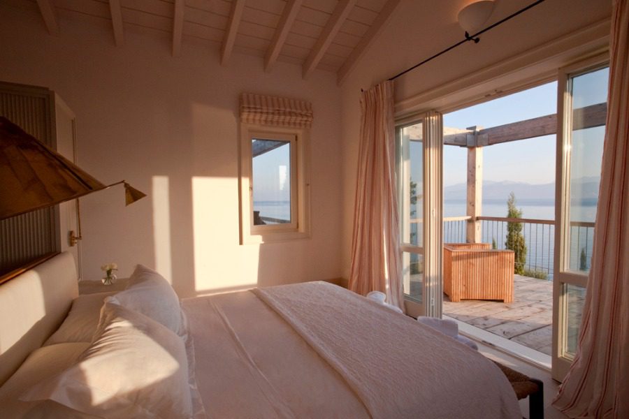 luxury villas - bedroom with double bed and balcony with sea view