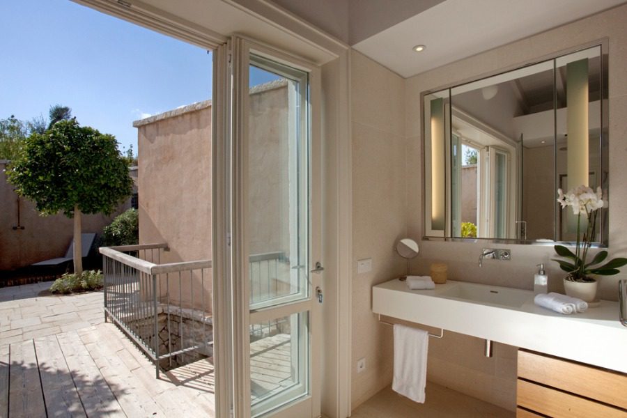 luxury villas - bathroom with sink and open door to terrace
