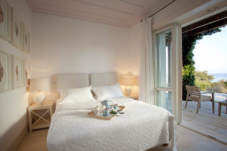 luxury villas - bedroom with double bed and terrace
