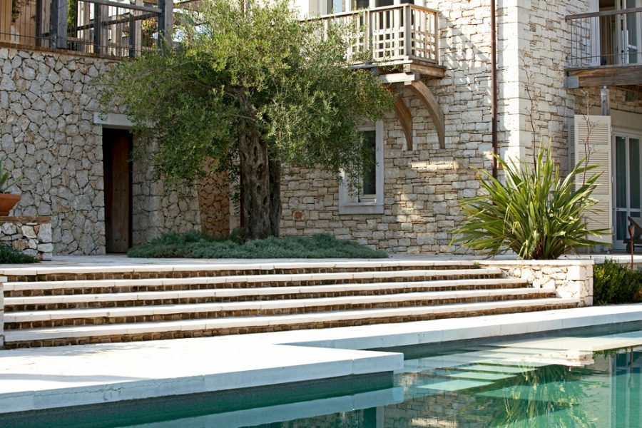 luxury villas - pool with stairs and entrance to villa