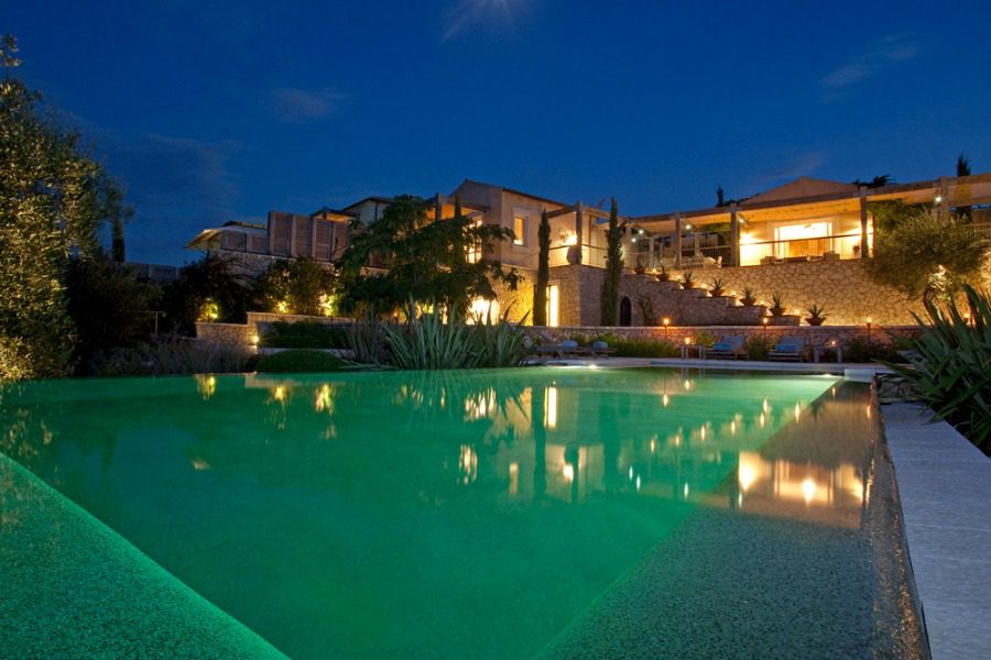 luxury villas - pool by night with villa in the background
