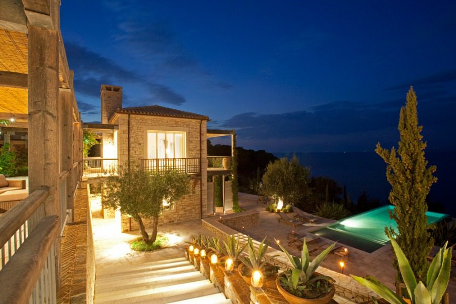luxury villas - outside view of villa with pool by night