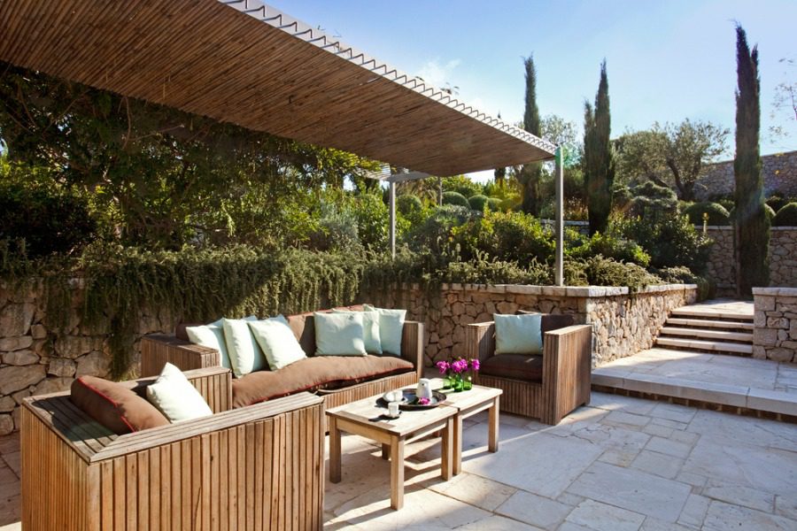 luxury villas - outside relaxing area with sofas and armchair