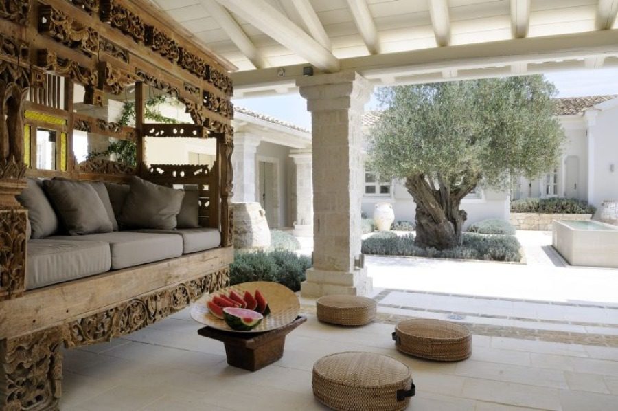 luxury villas - outside relaxing area with sofa and olive tree
