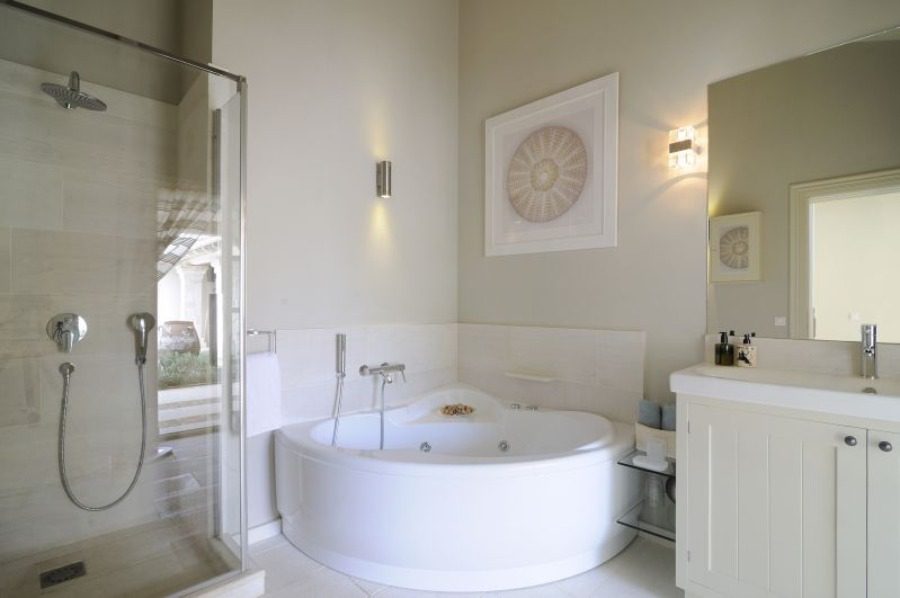luxury villas bathroom with shower and large wellness bathtub