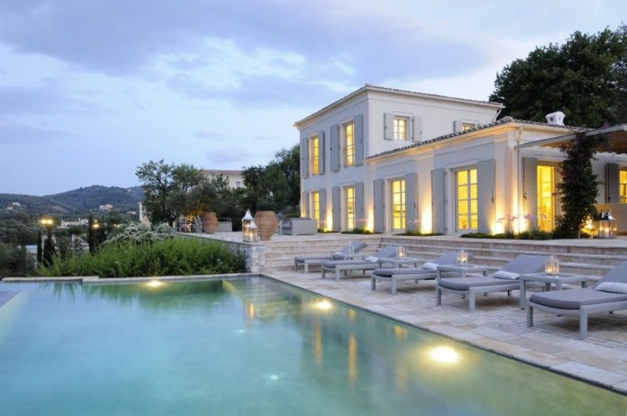 luxury villas - outside view at sunset of pool with villa