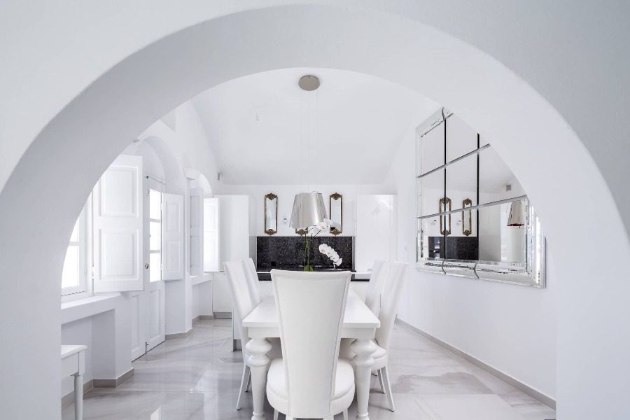 luxury villas - dining area in white with table and chairs