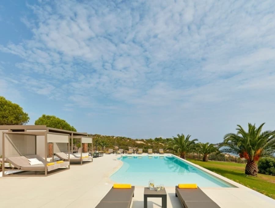 luxury villas - pool with sun beds and lounge