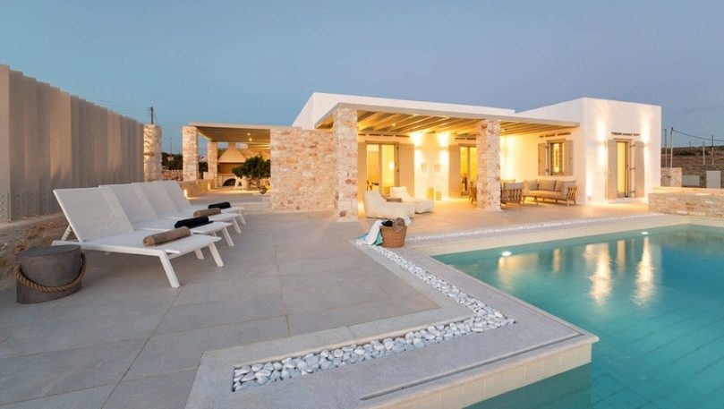 luxury villas - pool with sun beds by night