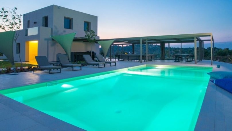 luxury villas - pool by night and villa